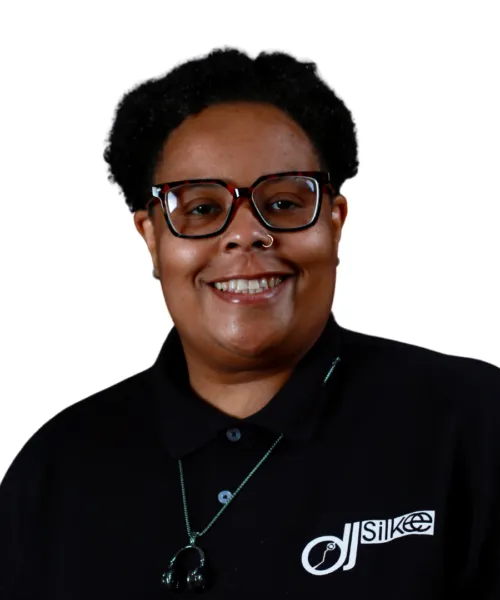 person wearing black shirt and glasses smiling