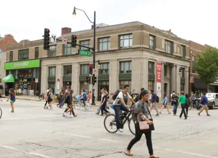 student walking across the street