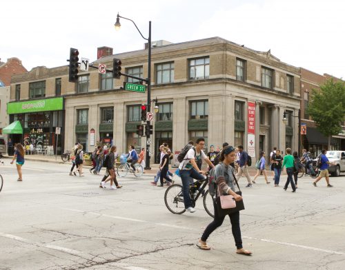 student walking across the street