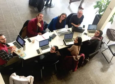 students around table in TBH