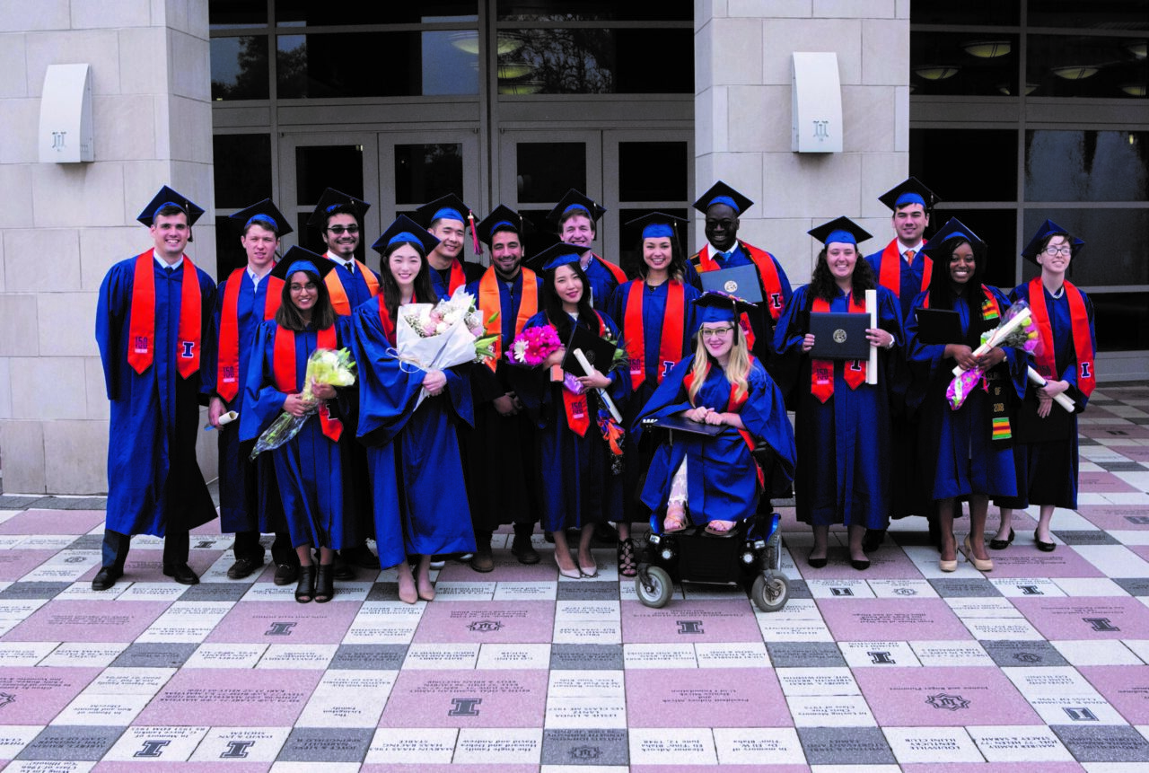Urban planning students in regalia on graduation day
