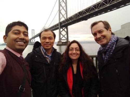 Professors Chakraborty, Zhang, and El-Gohary with Coach Glenn near Bay Bridge in San Francisco