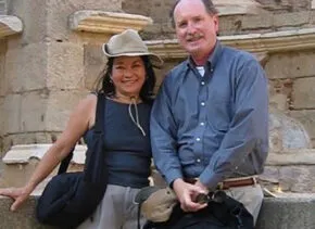 Photo of Doug and Laura in front of an old brick structure