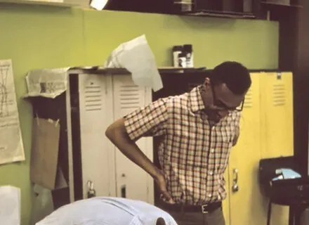 Photo of students in a basement lab