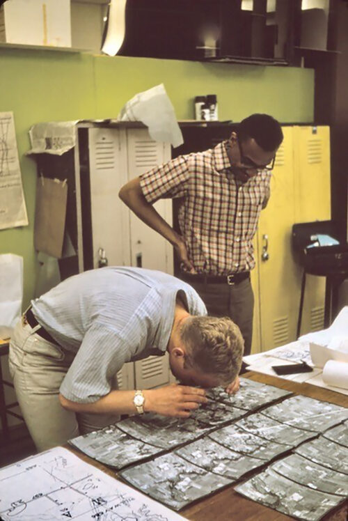 Photo of students in a basement lab