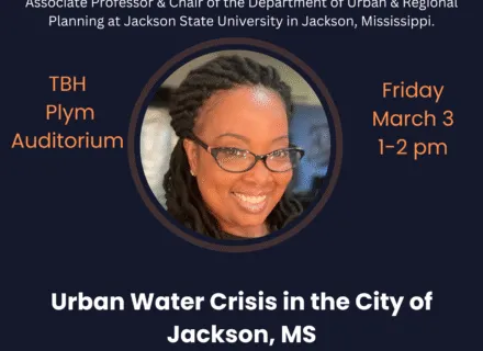 Blue poster with orange and white letting describing presentation by Dr. Herbert.