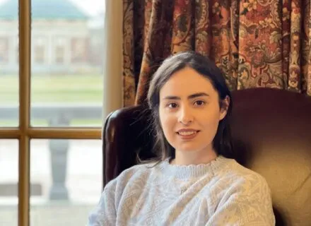 Photo of Shiva Sheikhfarshi with Foellinger Auditorium in background 