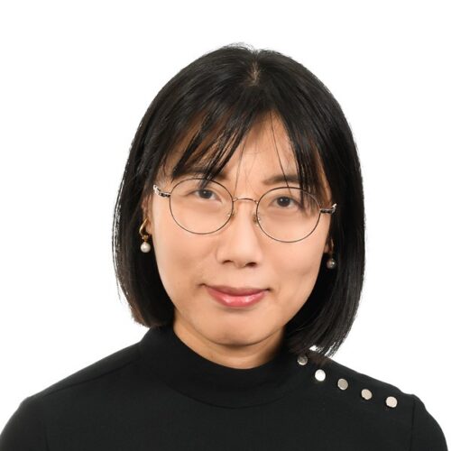 headshot of kerry fang wearing glasses and a black sweater