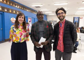 three people smiling