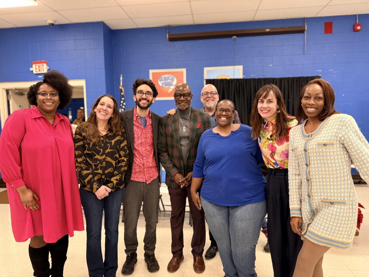 several people standing and smiling