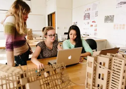 Student at a laptop in studio 