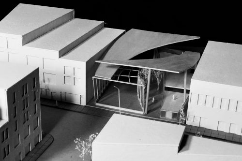 Aerial view of model with split curved roof 