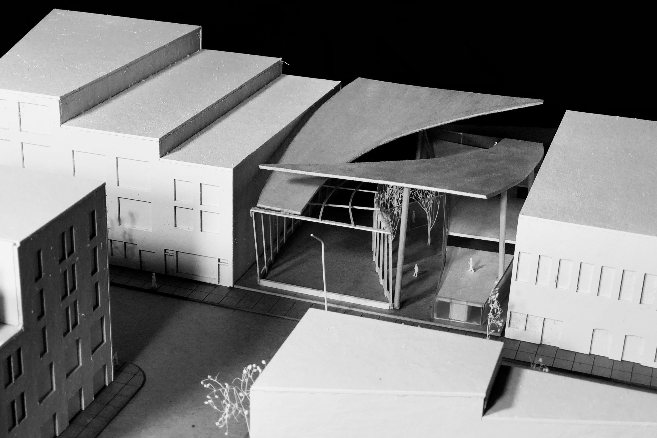 Aerial view of model with split curved roof