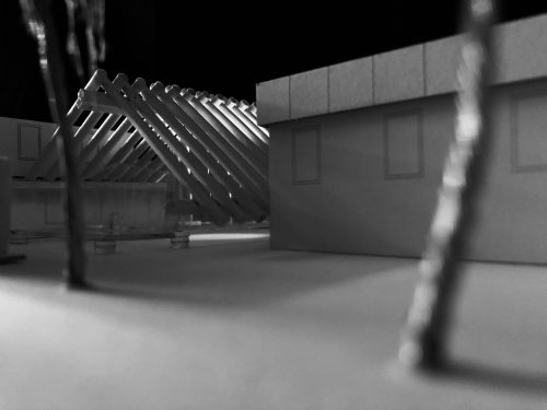 Black and white image: model of slanted roof 