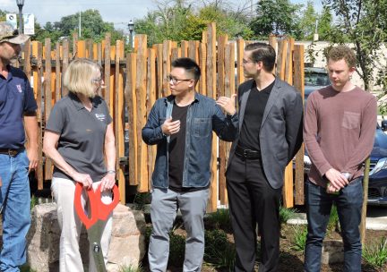 Group of faculty outside an a ribbon cutting ceremony