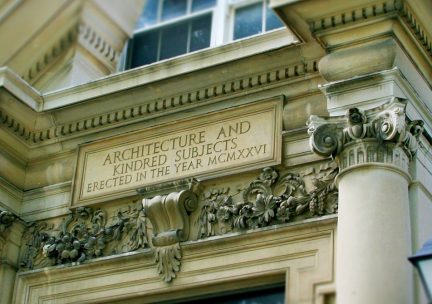 Photo of engraving above architecture building 