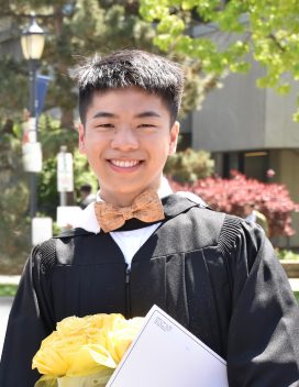 Headshot of Andrew Wei in graduation clothing 