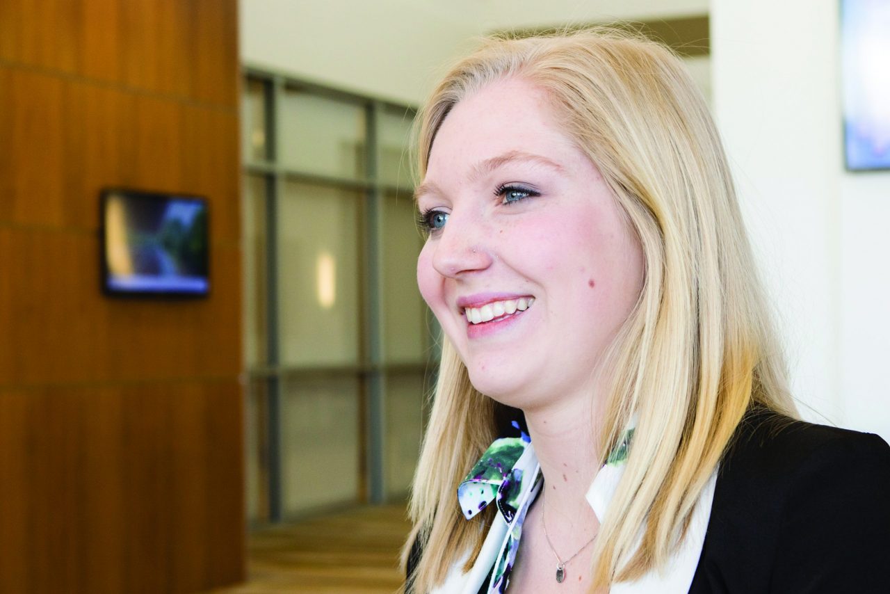 Female student smiling at the 2016 career xpo