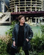 Carol Ross Barney standing next to the Chicago River 