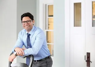 headshot of alex patsavas standing in an office 