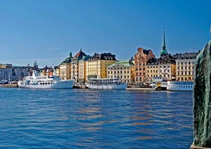 buildings in stockholm with water in foreground 