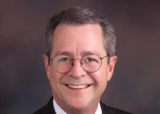 Headshot of Bob Selby wearing bow tie