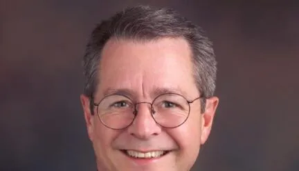 Headshot of Bob Selby wearing bow tie