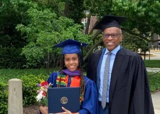 two people at graduation in regalia 