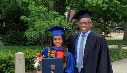 two people at graduation in regalia 