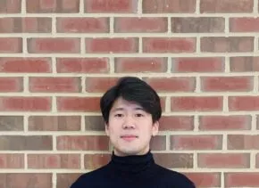 tai wakabayashi headshot against brick