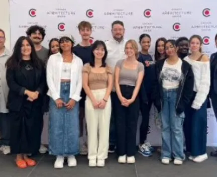 architecture students standing for formal picture with director