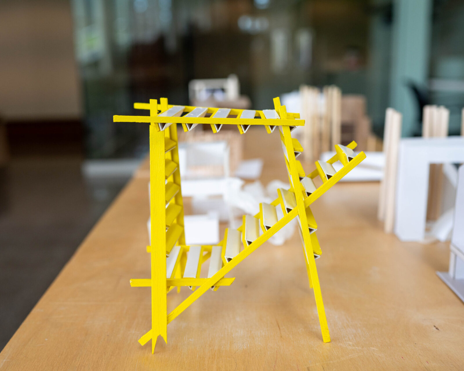 yellow student project, looks like stairs, with money bars