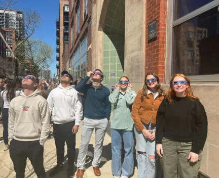 Spring 2024 Chicago Students using 3D glasses on city street