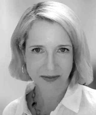 emelie mies black and white picture close up unsmiling face focused face length blonde hair 