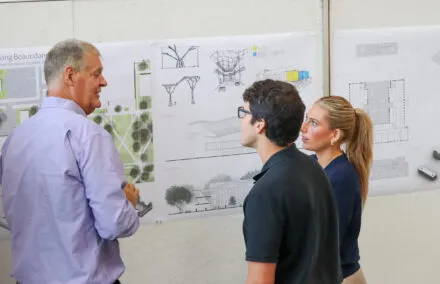 people gathered around a poster