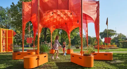 orange structure outdoors with kids playing