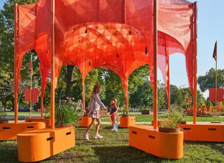 orange structure outdoors with kids playing