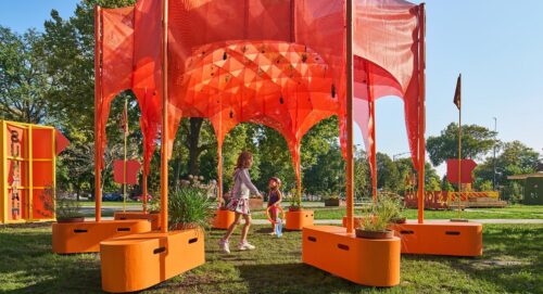 orange structure outdoors with kids playing