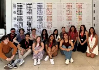 students sitting in front of their work