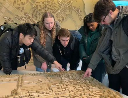 students standing around looking at a model