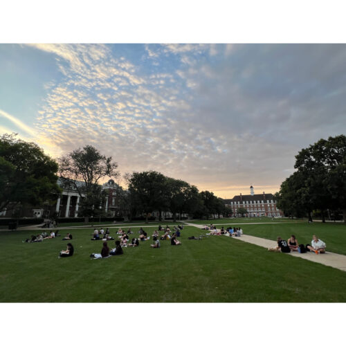 sun going down on students working in north quad