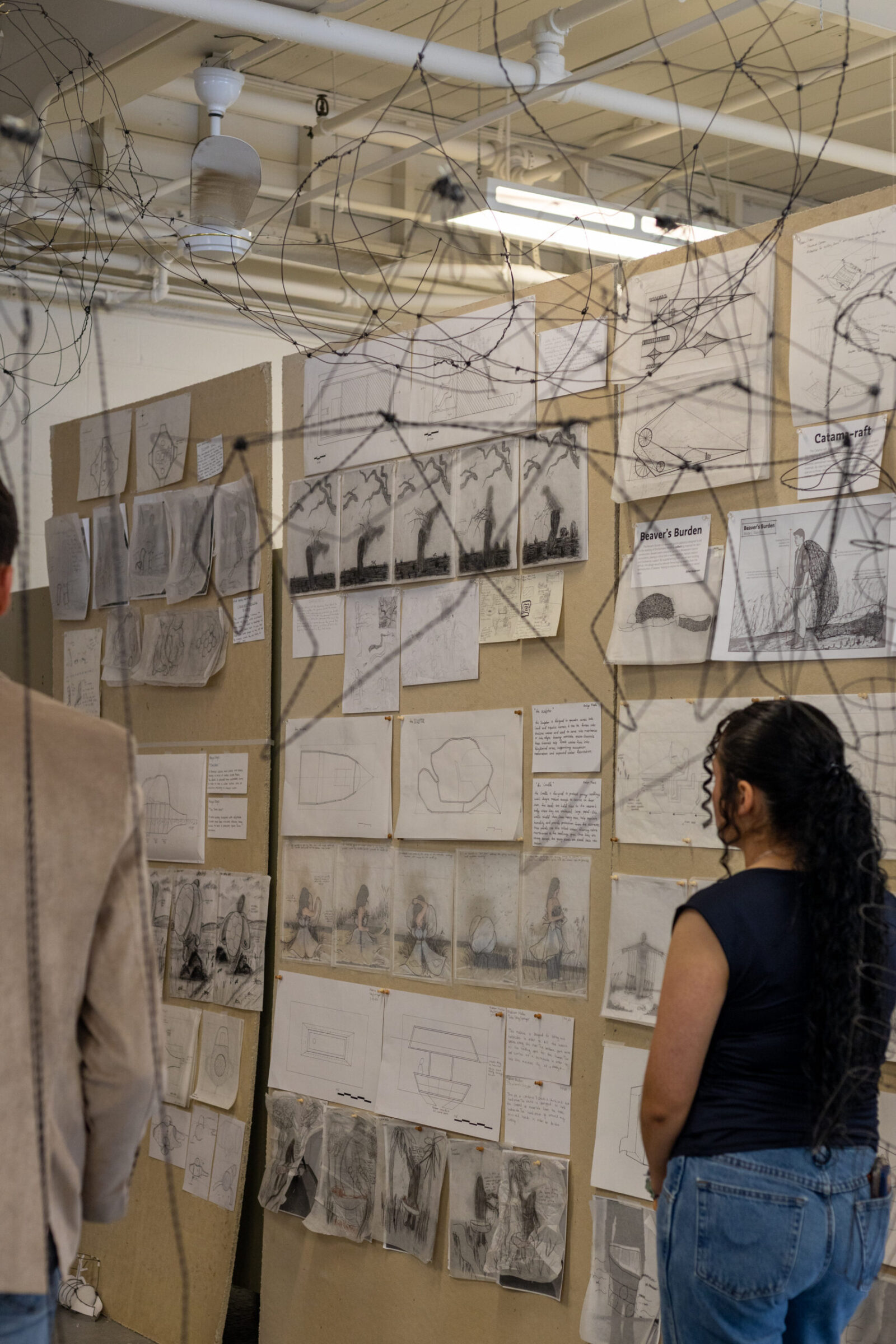picture of a few dozen student of arch drawings