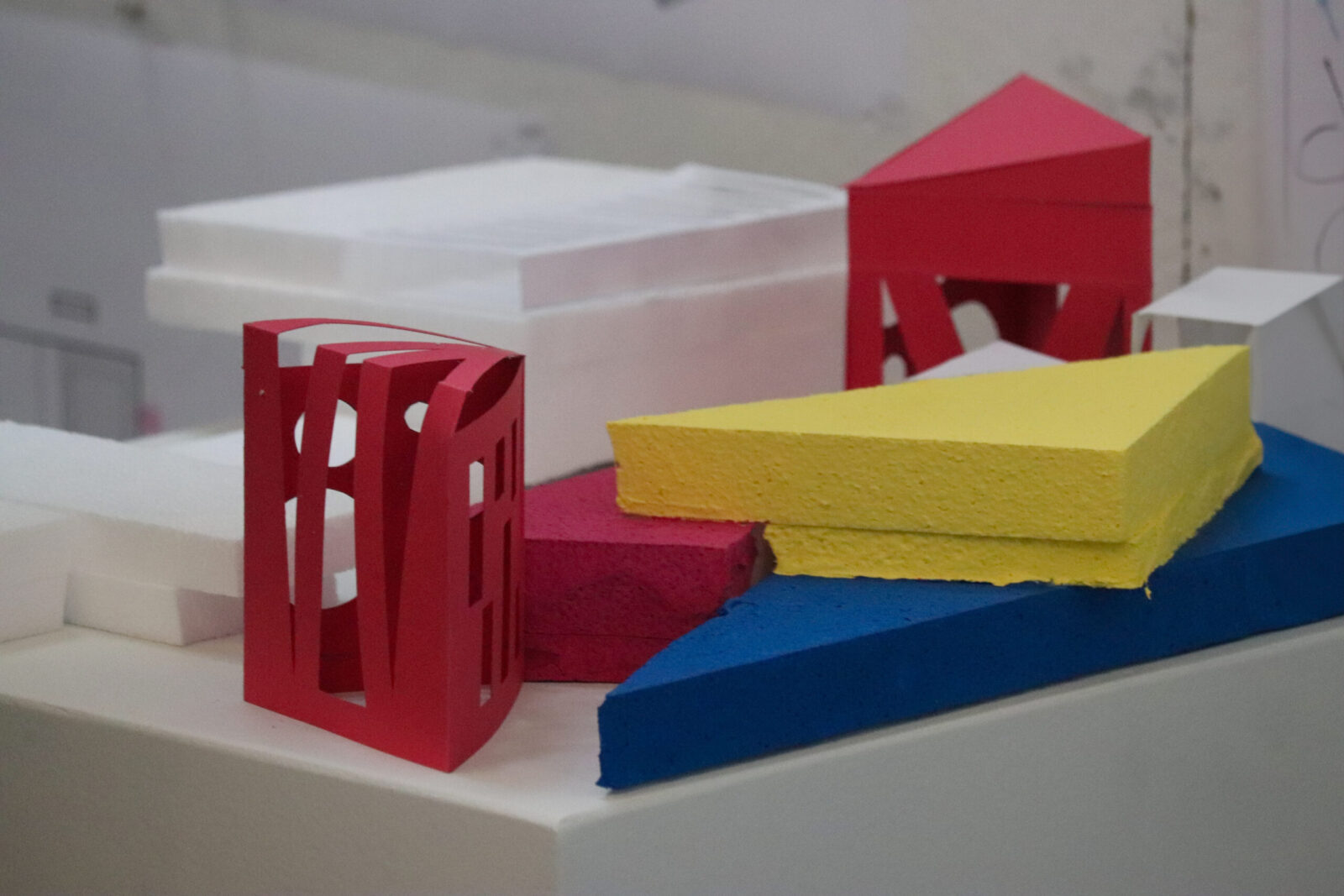 arch 2nd year model red buildings yellow concrete and blue water