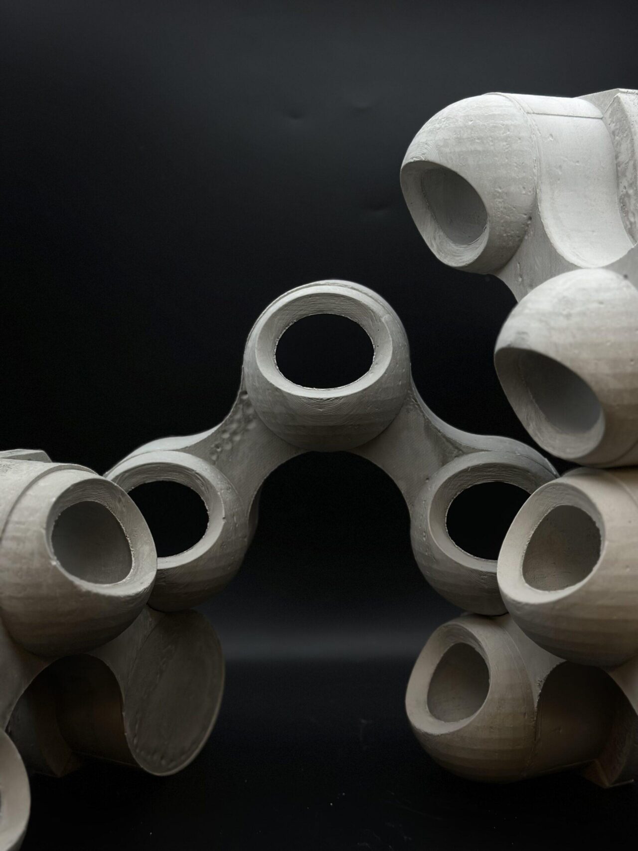 Students in masks holding building materials 