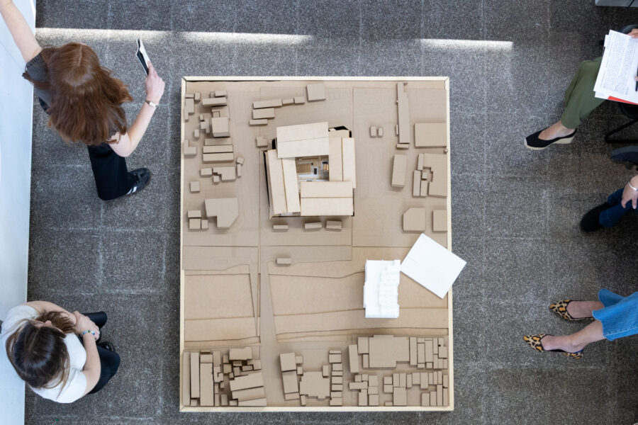a view of a model from above with people around it