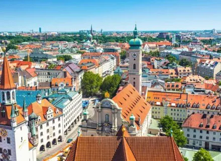 birds eye view of munich, with colorful roofs and towers