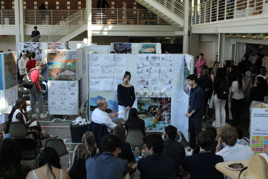 students presenting architecture projects for an audience