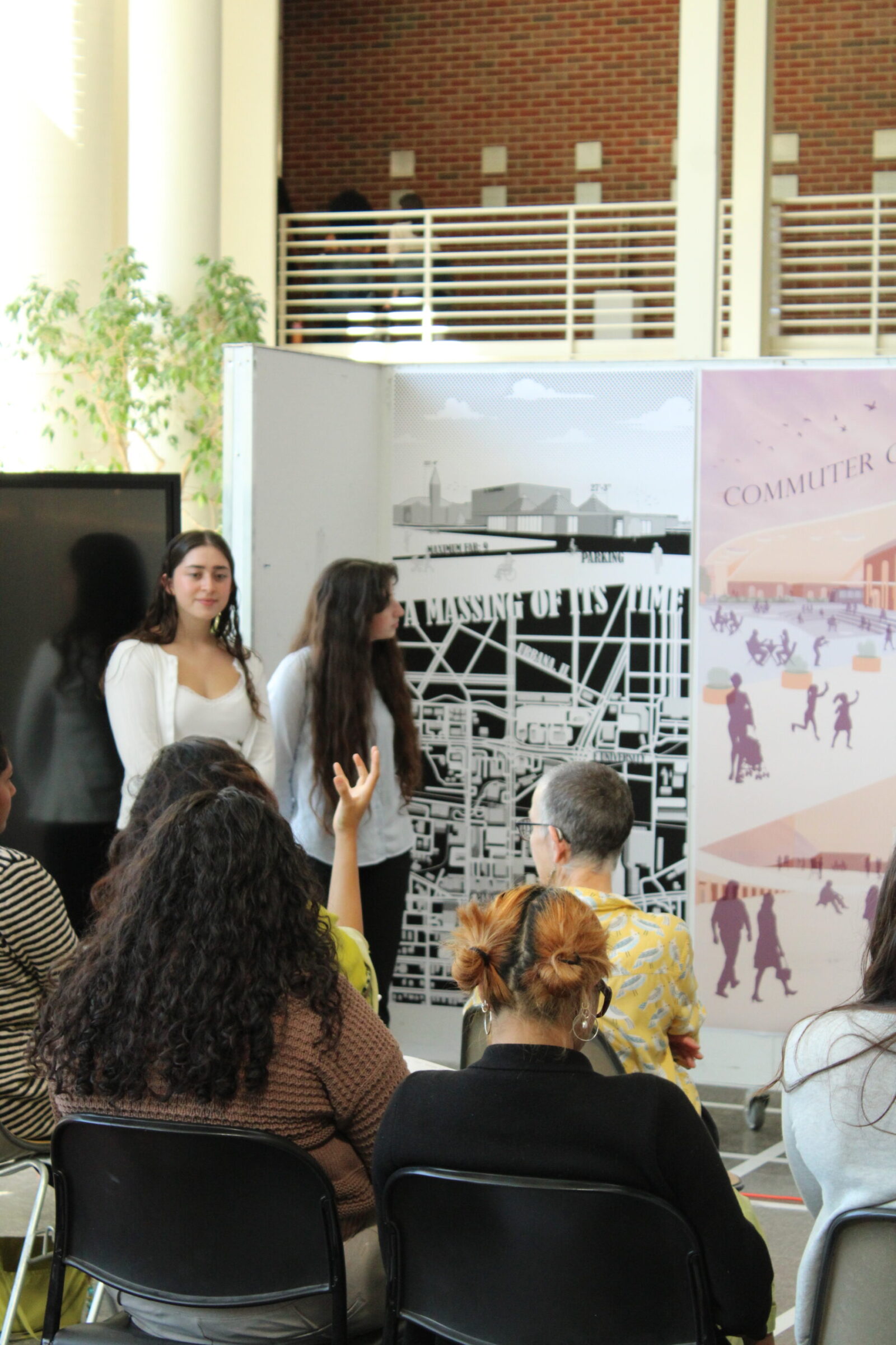 students standing in front of posters