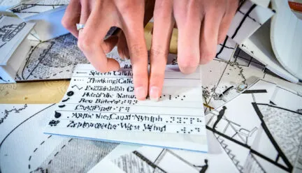 hands run across raised text