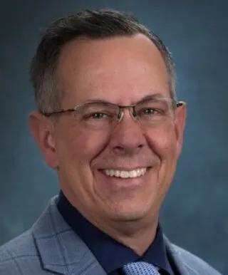 White male with black and grey hair